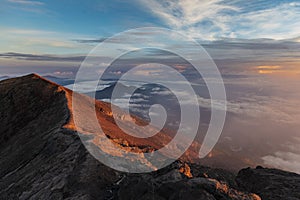 Sunrise at the top of agung volcano. crater view