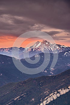 Sunrise on top of a snowy mountain