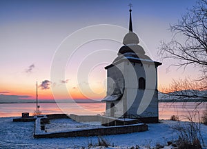 Sunrise and tower of church at reservoir Liptovska Mara, Slovak