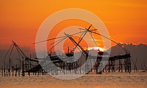 Sunrise with traditional fishing trap in Pak Pra village, Phatthalung, Thailand