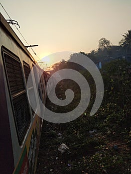 Sunrise with train in morning mumbai local train