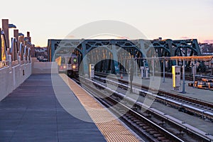 Sunrise on the train platform as the G Train arrives at the Smith Street