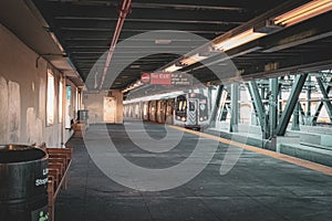 Sunrise on the train platform as the G Train arrives at the Smith Street