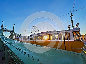 The sunrise through the tram on Liberty Bridge, Budapest, Hungary