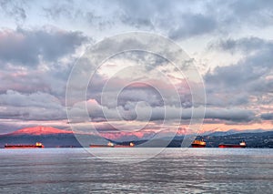 Sunrise With Transport Boats and Pink Mountains