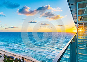 Sunrise on the tropical beach of Cancun, beautiful sea in Mexico. Beautiful shining clouds. Place for text