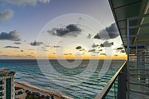 Sunrise on the tropical beach of Cancun, beautiful sea in Mexico. Beautiful shining clouds. Place for text