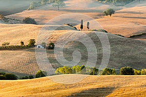 Sunrise in tuscan countryside near Pienza, Italy