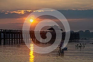 Sunrise on U Bein bridge near Mandalay in Myanmar