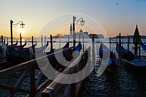 Sunrise in Venice with gondolas