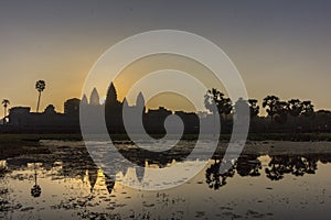 Sunrise view of ancient temple complex Angkor Wat and lake reflection, Siem Reap, Cambodia