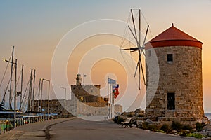 Sunrise view of ancient windmills at the port of Rhodes, Greece