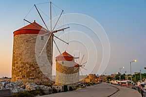 Sunrise view of ancient windmills at the port of Rhodes, Greece