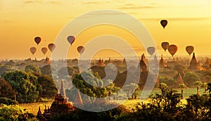 Sunrise view of beautiful pagodas and hot air balloons, Myanmar