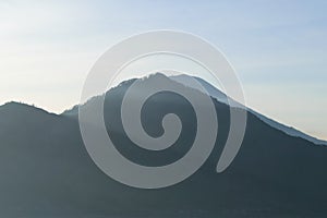 Sunrise view from Gunung Batur volcano in Bali with visible Mount Agung volcano photo