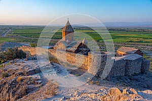 Sunrise view of Khor Virap Monastery standing in front of Ararat