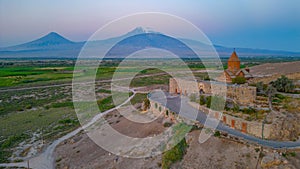 Sunrise view of Khor Virap Monastery standing in front of Ararat