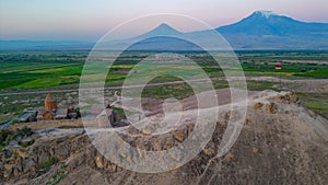 Sunrise view of Khor Virap Monastery standing in front of Ararat