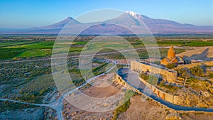 Sunrise view of Khor Virap Monastery standing in front of Ararat