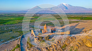 Sunrise view of Khor Virap Monastery standing in front of Ararat