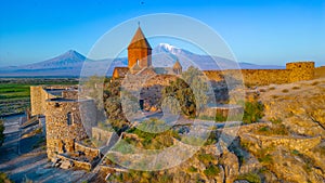 Sunrise view of Khor Virap Monastery standing in front of Ararat