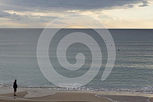 Sunrise view of the Mediterranean Sea. Clouds and silhouette of a man