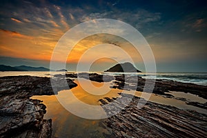 Sunrise view with seascape and rocks