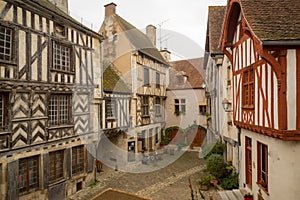 Square with half-timbered houses, in the medieval village Noyers-sur-Serein photo