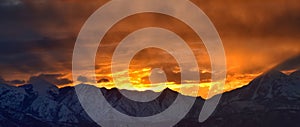 Sunrise view of winter panorama. Snow capped Mount Timpanogos in the Wasatch Front Rocky Mountains, Great Salt Lake Valley and Clo