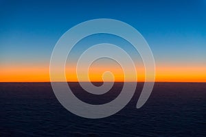 Sunrise from the window of the plane