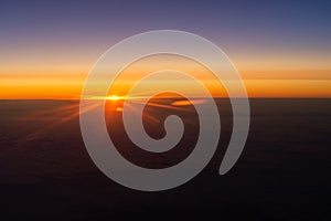 Sunrise from the window of the plane