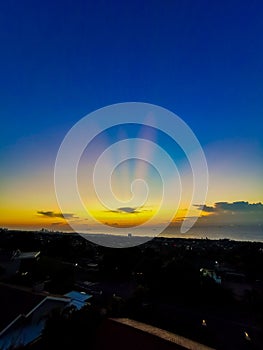 Sunrise winter city Sundays clouds beach ships ocean blue orange photo