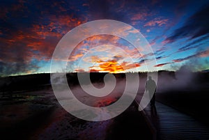 Sunrise Yellowstone Geysers with Man Silhouetted photo