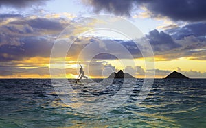 Sunrise yoga on paddle board