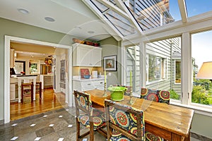 Sunroom patio area with dining table set