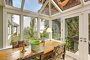 Sunroom patio area with dining table set