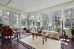 Sunroom with red brick flooring