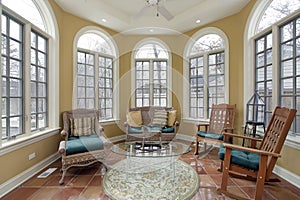 Sunroom with terra cotta floors photo