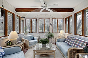 Sunroom with wood ceiling beam