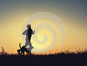 Sunrset runner with dog