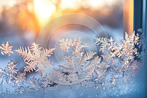 The suns rays shine through a frosted window, casting a warm glow and brightening the space, A sparkling frost formation on a