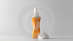 Sunscreen bottle with a pump and a dollop of cream against a clean, white background