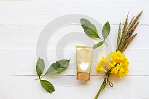 Sunscreen spf50 cosmetics beauty makeup for skin face with bouquet yellow flowers of lifestyle woman