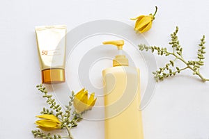 Sunscreen spf50  cosmetics health care for skin face with body lotion of lifestyle woman and flower ylang ylang