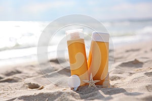 Sunscreens on the beach near the sea close up