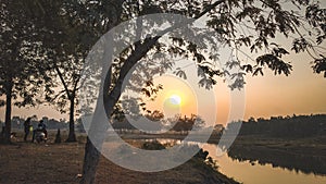 Sunser sunrise trees orange river lake