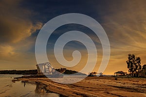 sunset, Abandoned old boat on a deserted beach