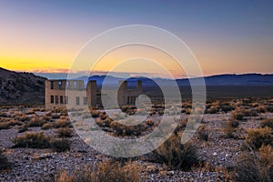 Sunset above abandoned building in Rhyolite, Nevada