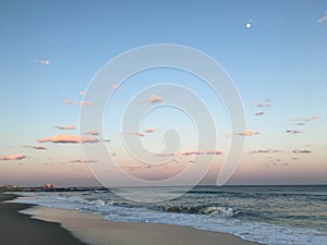 Sunset above Atlantic Ocean in April in Far Rockaway, Queens, New York.