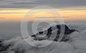 Sunset above clouds on Mount Kilimanjaro with yellow sky